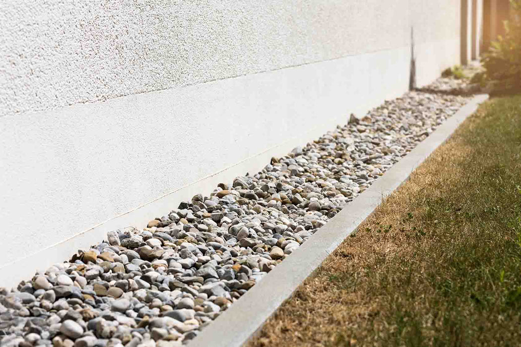 "1 ½” Local River Rock used in a landscaped garden or water feature"

